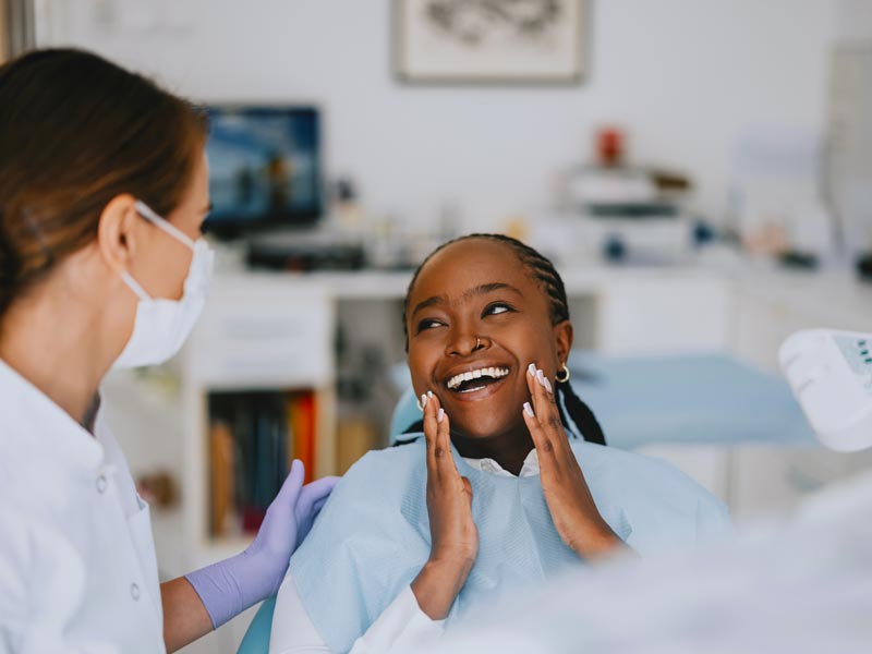 Happy Patient at Dental Clinic After Successful Checkup